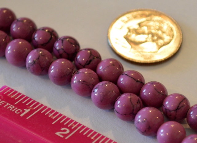 Magnesite 6mm round - Violet With Black Inclusions